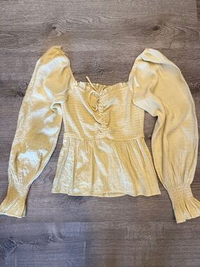 A. Calin by flying tomato creme yellow Smocked Puff-Sleeve Peplum Blouse Size M